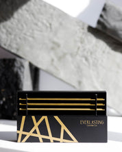 Black and gold box with 'Everlasting Candle Co' branding on a textured surface.