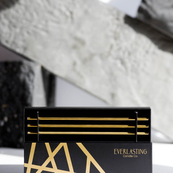 Black and gold box with 'Everlasting Candle Co' branding on a textured surface.