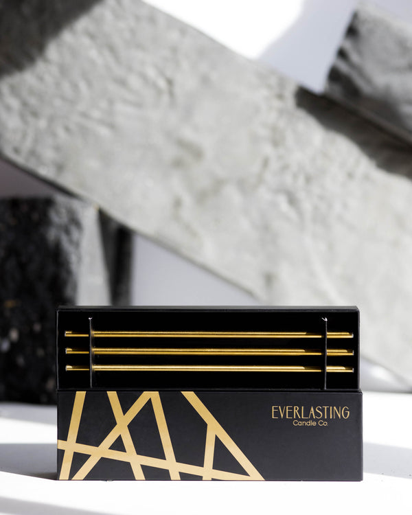 Black and gold box with 'Everlasting Candle Co' branding on a textured surface.