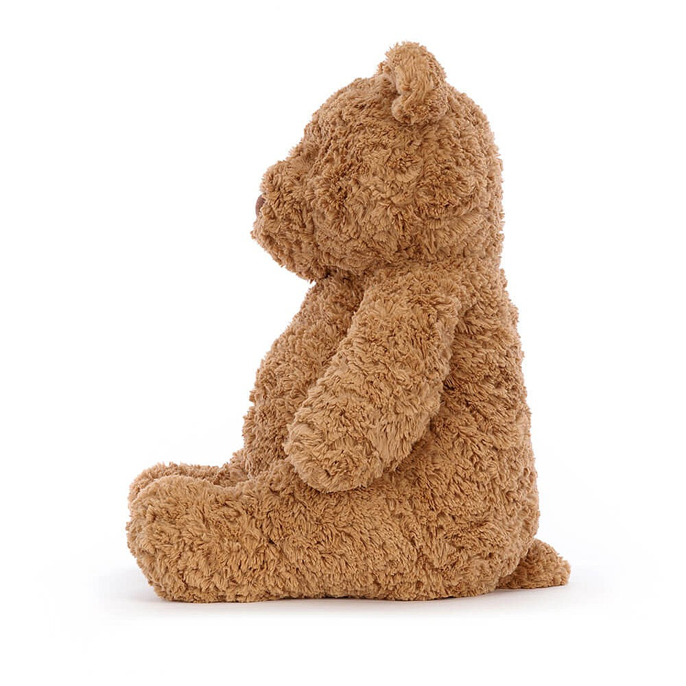 side view of small fluffy brown bartholomew bear stuffed plush toy made by jellycat