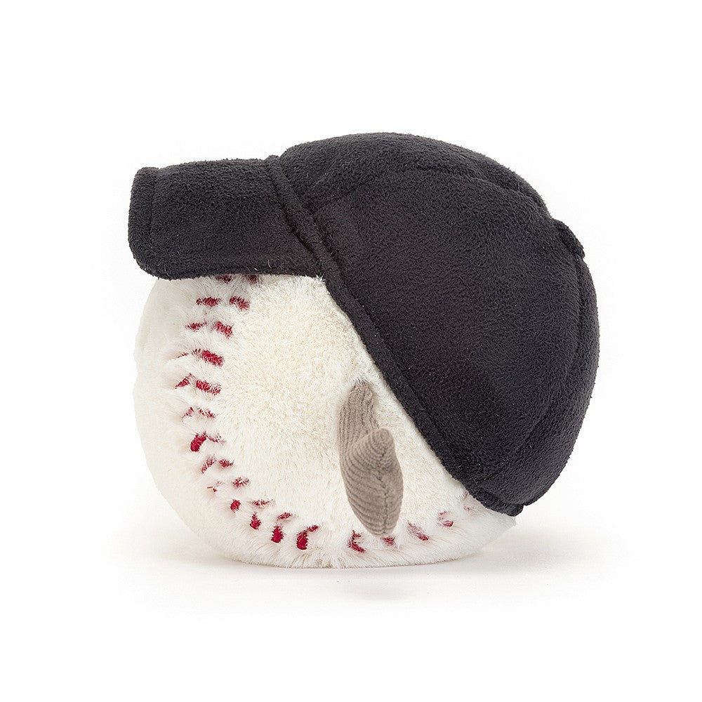 side view of stuffed plush toy of white baseball with red stitching, blue cap made by jellycat