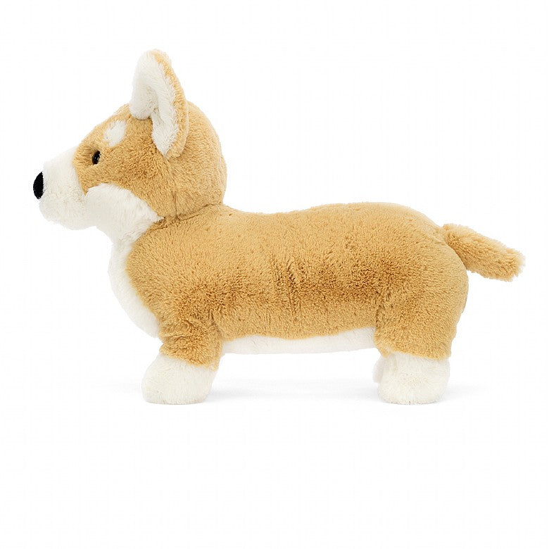 side view of stuffed plush toy of a beige and white fluffy corgi dog made by jellycat