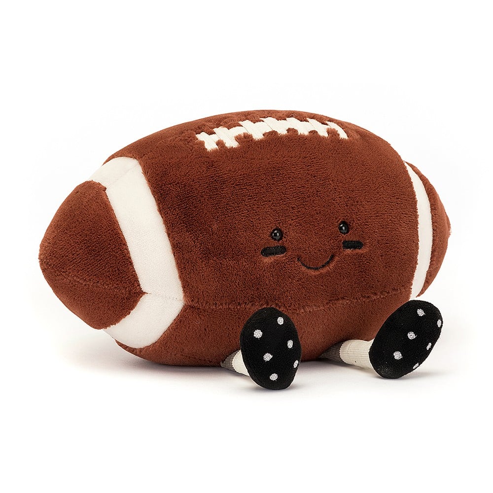 fuzzy soft brown american football stuffed plush toy with black smiley face and cleats made by jellycat
