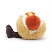 side view of fluffy stuffed plush toy hotdog with mustard made by jellycat