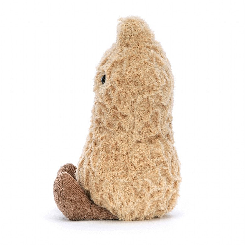 side view of light brown fluffy stuffed plush toy peanut with black smiley face made by jellycat
