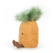 side view of luffy yellow and green pineapple stuffed plush toy with black smiley face made by jellycat