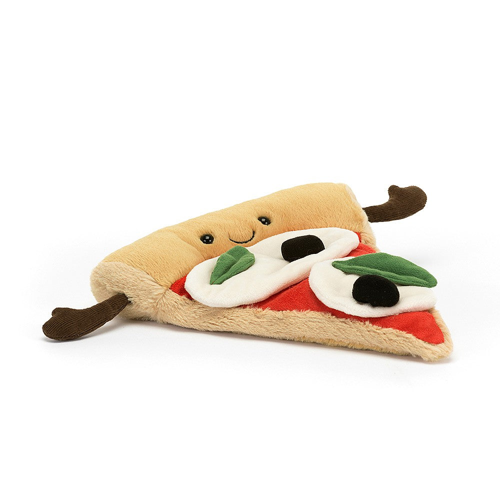 stuffed plush toy of a pizza slice with black olives, basil and cheese with a black smiley face made by jellycat