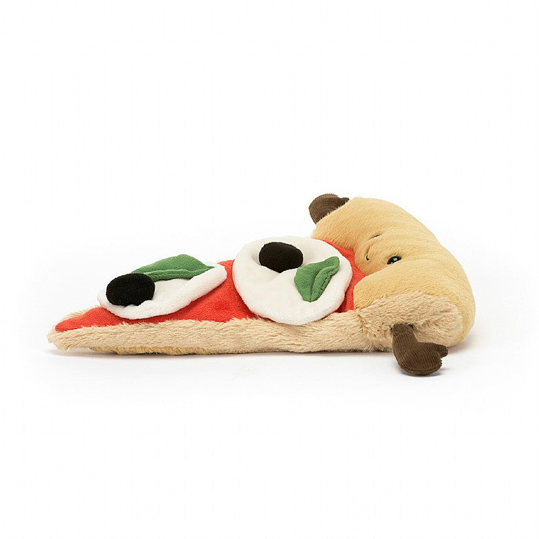 side view of stuffed plush toy of a pizza slice with black olives, basil and cheese with a black smiley face made by jellycat