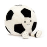 stuffed plush toy of a black and white soccer ball  with cleats and black smiley face made by jellycat