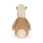 Back view of a plush beige pony with white tail and main on a white background