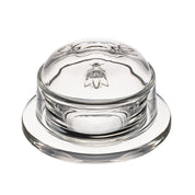 Clear glass butter dish with dome with intricate bee design on a white background