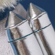 close up of shiny rocketpack details from plush toy
