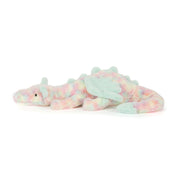 Plush dragon toy with pastel colors on a white background
