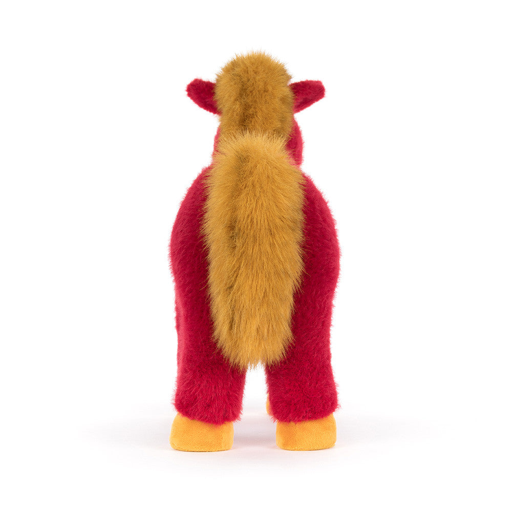 back view of red plush horse with golden tail and yellow hooves on white background