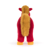 back view of red plush horse with golden tail and yellow hooves on white background