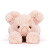 Pink plush pig toy on a white background