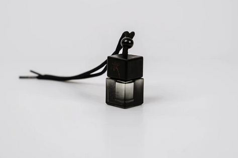 Black oil diffuser bottle from gt naked essentials on a white background