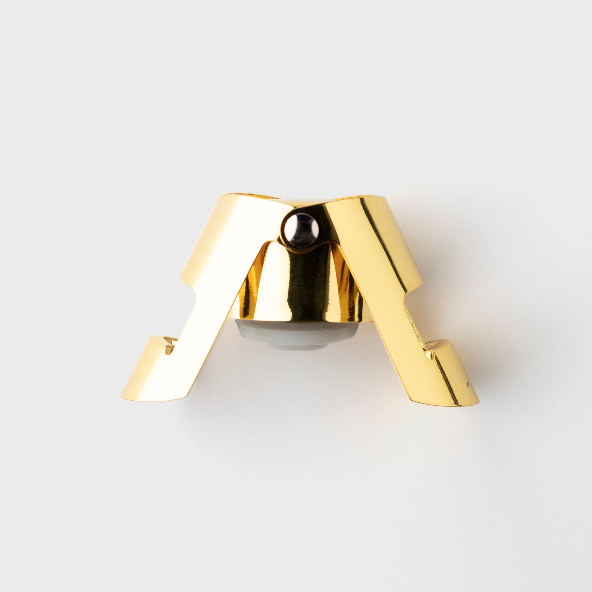 Gold champagne stopper on a white background