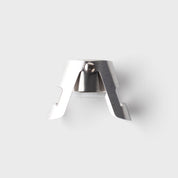 silver Taproom bottle stopper against a white background