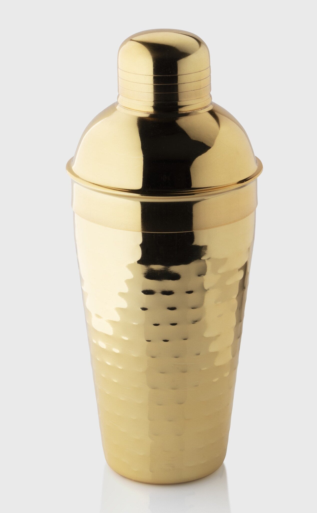 Gold cocktail shaker on a white background
