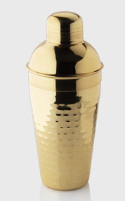 Gold cocktail shaker on a white background