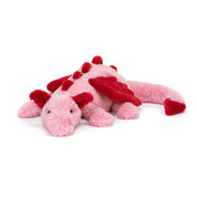 Pink and red plush dragon toy on a white background