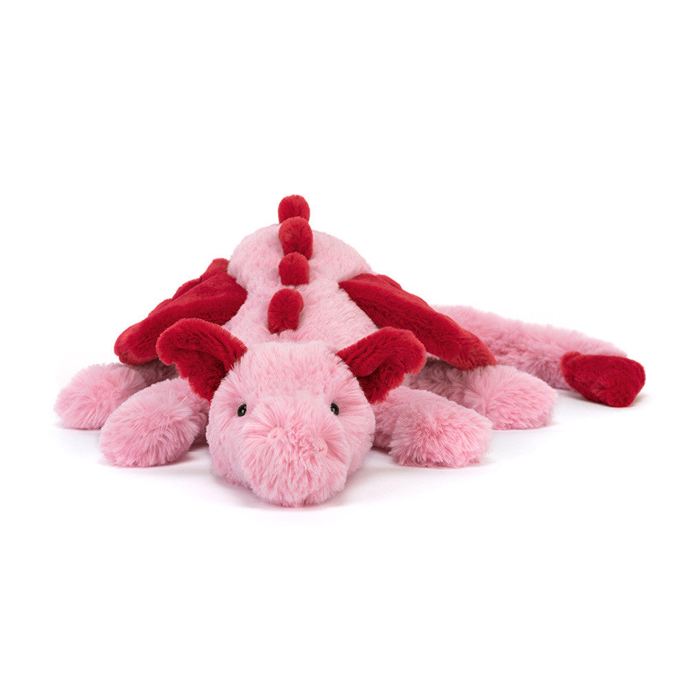Pink and red plush dragon toy on a white background