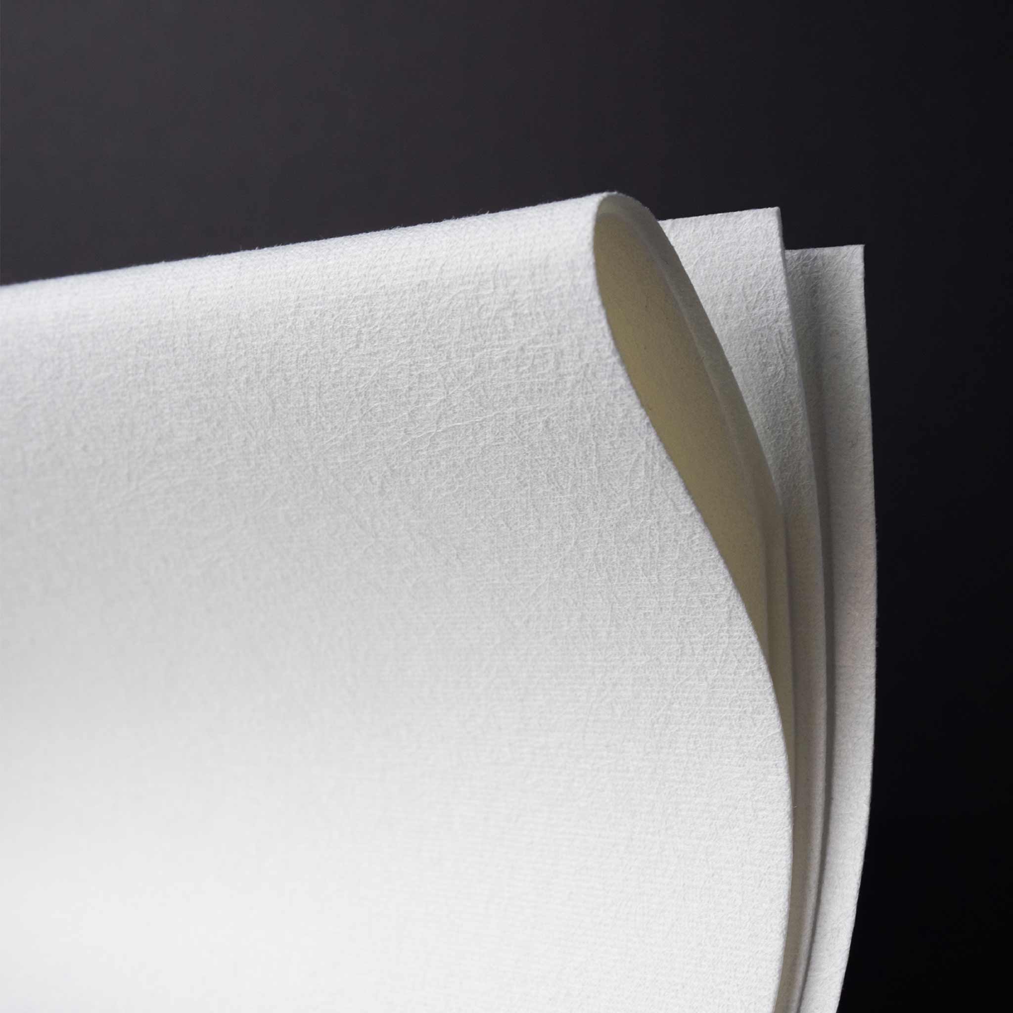 Close-up of white jude's cleaning cloth with a black background