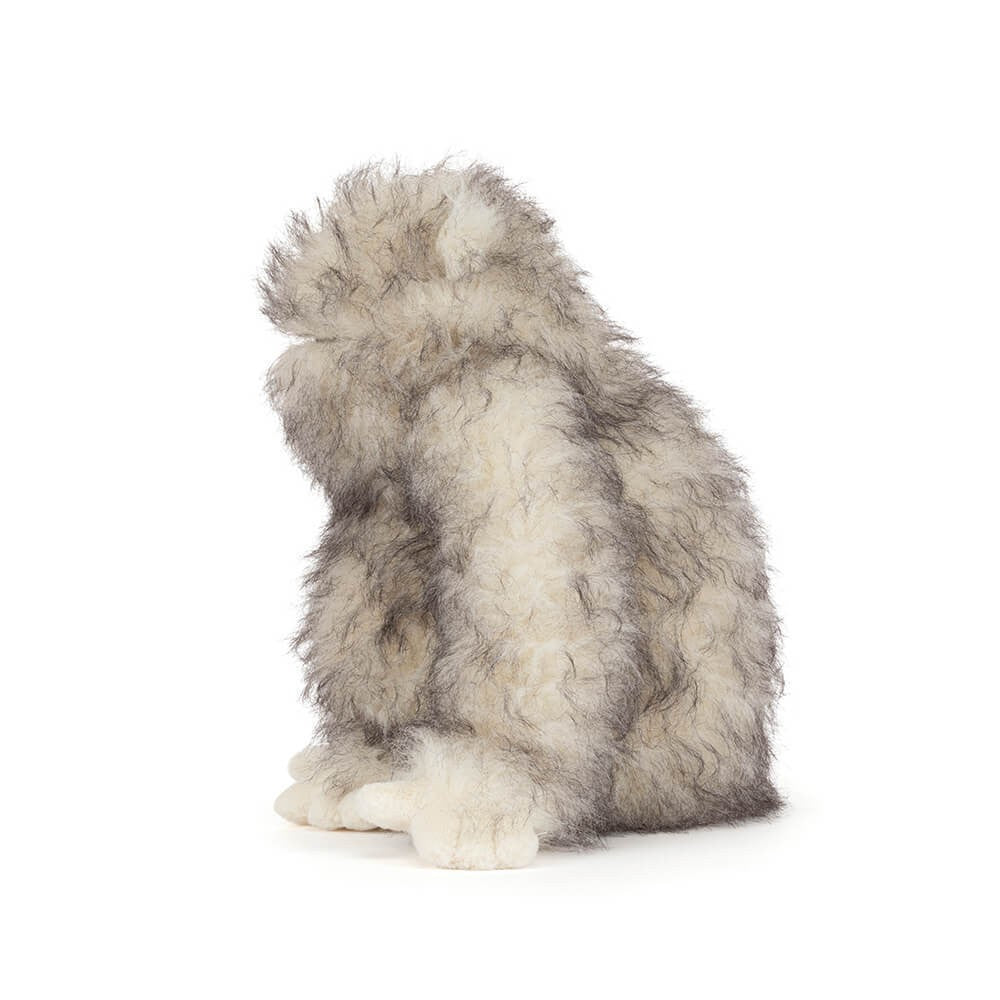 side view of Yeti Plush Toy by Jellycat with fluffy grey & white fur