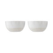 Two white ceramic bowls with 'artisan set' branding on a white background