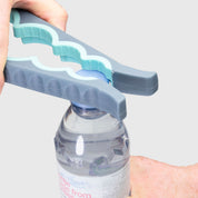 Hand using a bottle opener on a water bottle against a light gray background