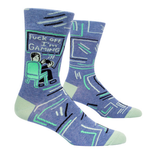 blue socks with person in chair playing video game, screen says fuck off, i'm gaming