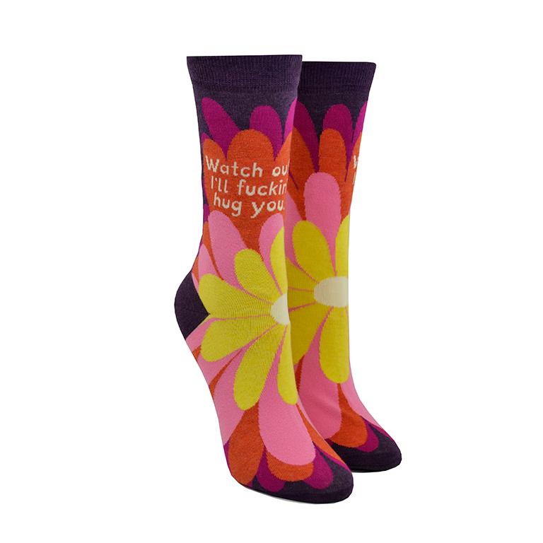 socks with warm coloured flowers says watch out i'll fucking hug you