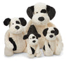 four different sized black and white bashful puppies stuffed plush toys made by jellycat