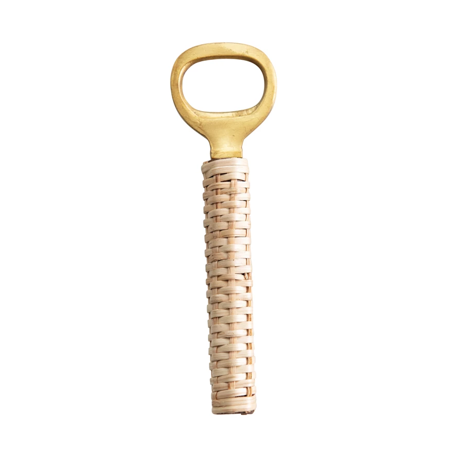 gold and rattan wrapped bottle opener on white background