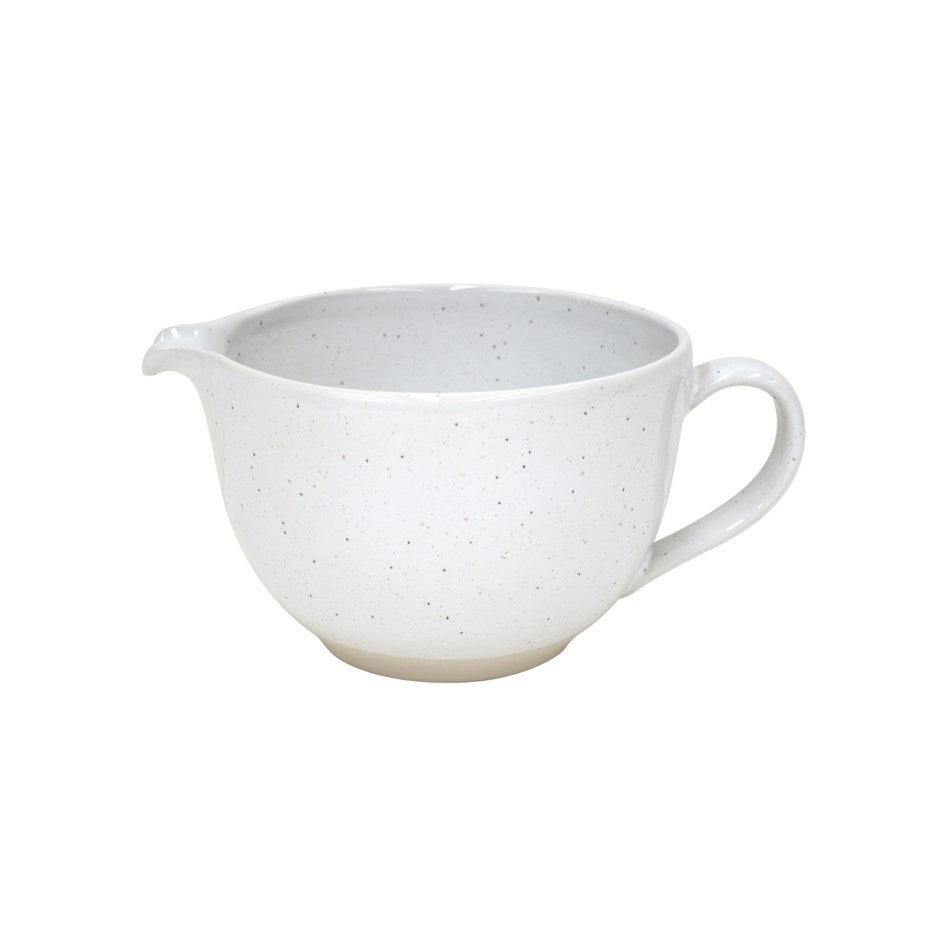 two toned stoneware batter bowl; white speckled glaze with unglazed natural bottom. on white background