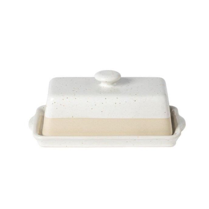 white speckled glazed and half unglazed stoneware butterdish with lid. on white background