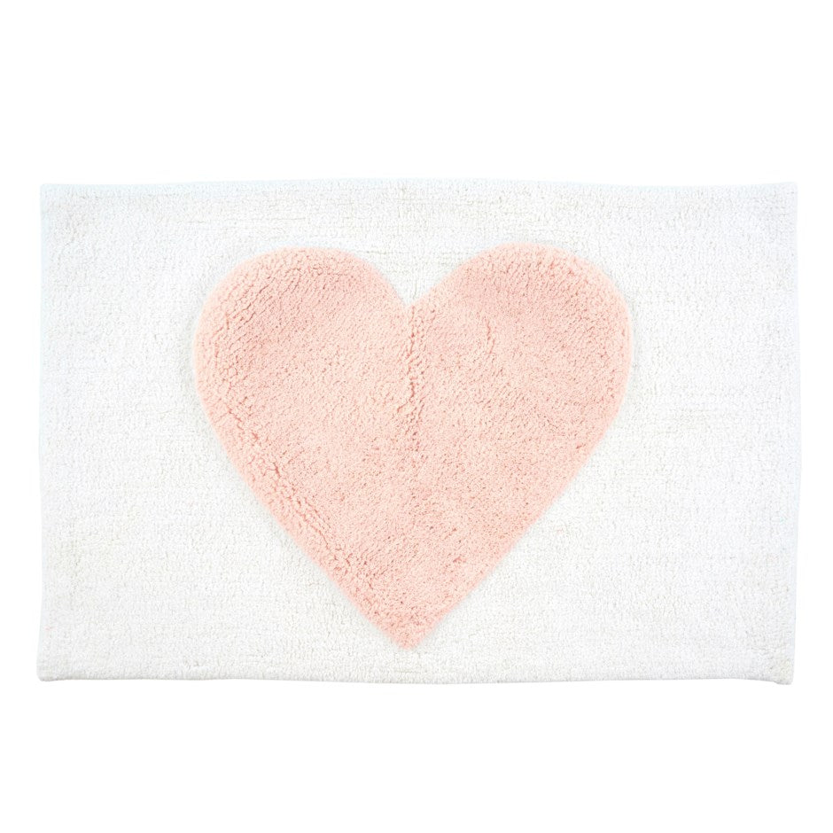 white plush bathmat with big light pink heart in the middle. on white background