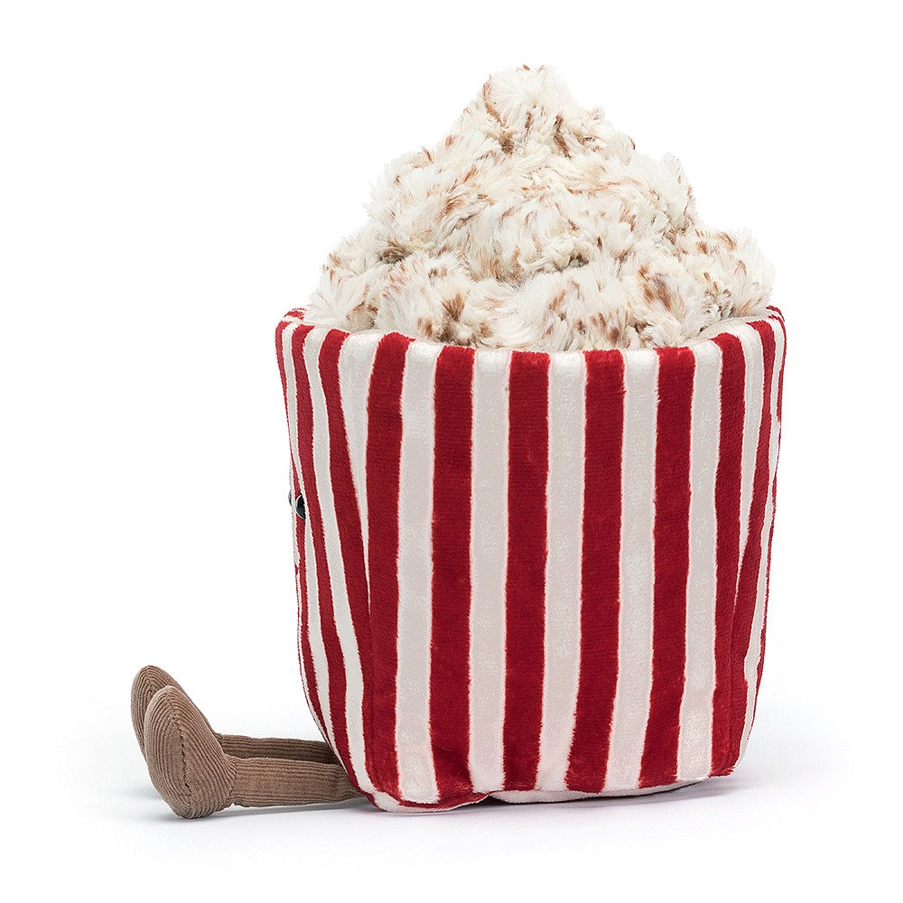 side view jellycat plush toy red white stripe popcorn bag with face and brown legs on white background 