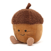 brown stuffed acorn plush toy with black smiley face
