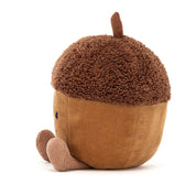side view of brown stuffed plush toy acorn