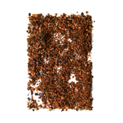 pile of caramelized coffee rub shaped into a rectangle on white background 