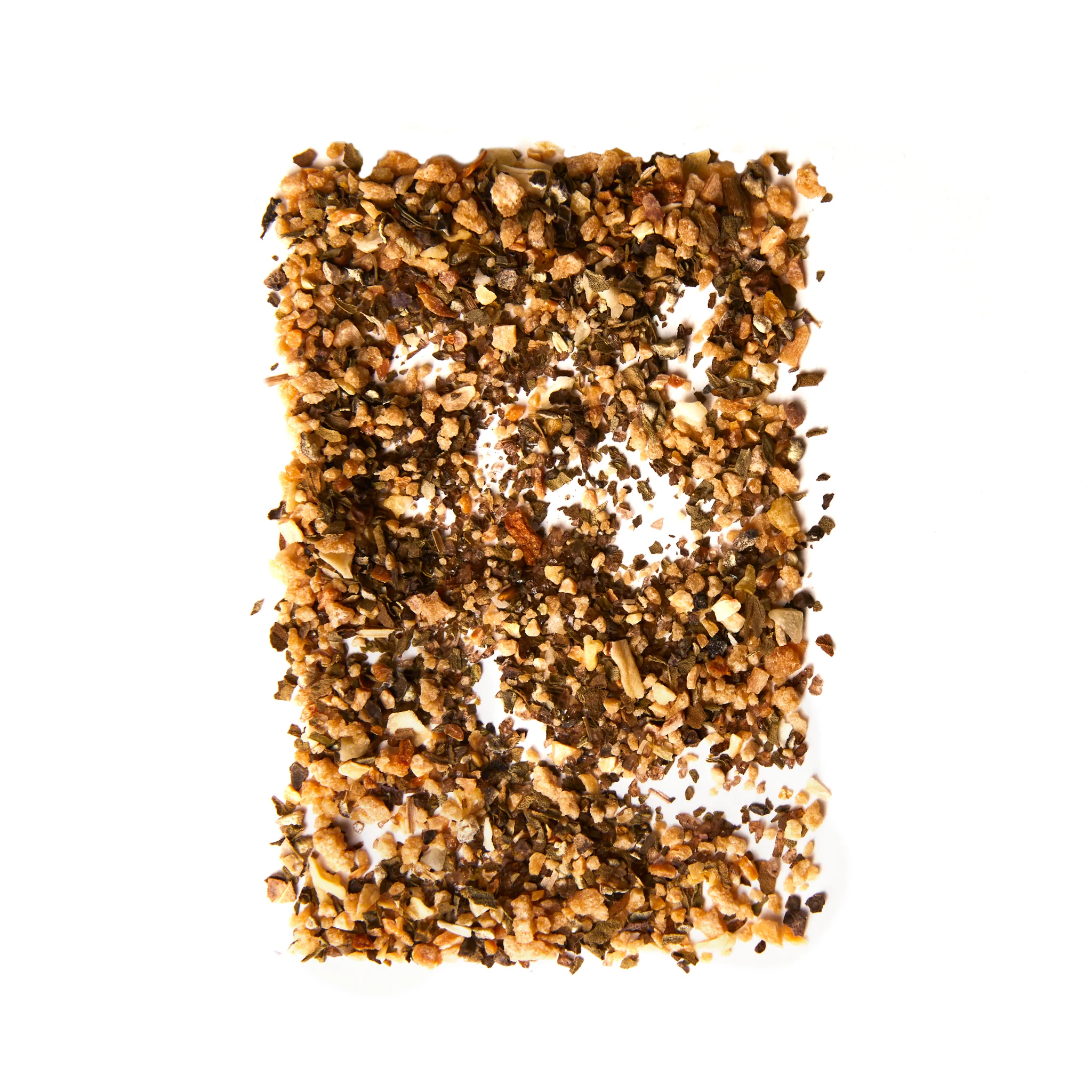 pile of quebec maple smoked salt shaped into a rectangle on white background