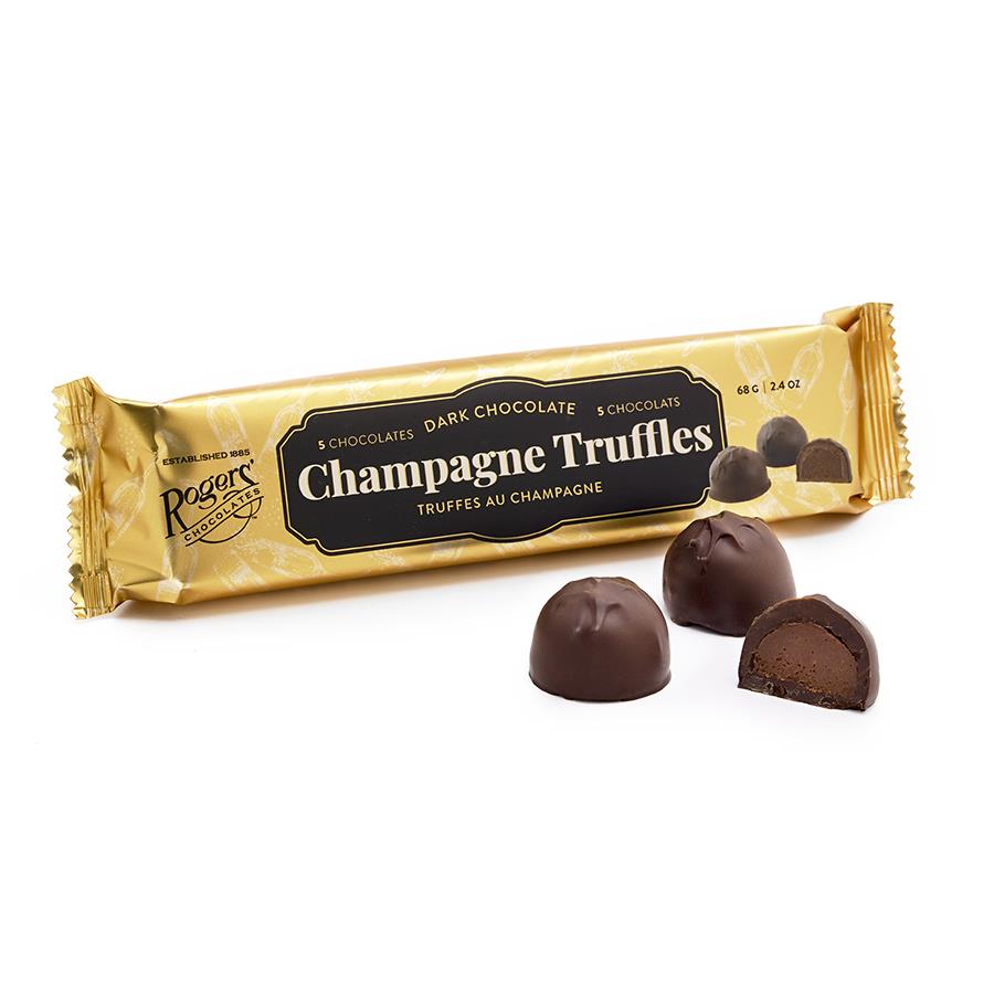 gold sleeve of dark chocolate champagne truffle from rogers chocolates 2 whole and 1 half pieces in front on white background